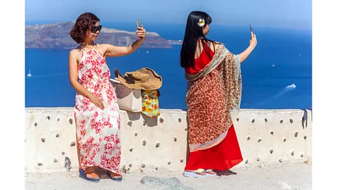 Alamy The rise of sharing photos of travel on social networks can play a role in choice of our vacation kits (credit: alamy)