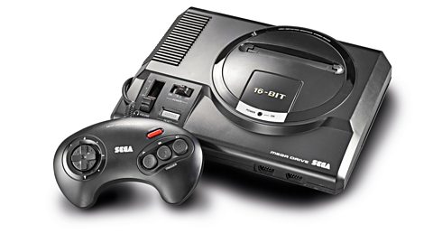 A Sega Mega Drive console, all in black, on a white backdrop, with a controller perched against its front left side