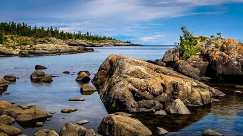 Getty Images Parts of Isle Royale shoreline were once submerged beneath prehistoric glacial lakes, leaving behind wave-rounded boulders (Credit: Getty Images)