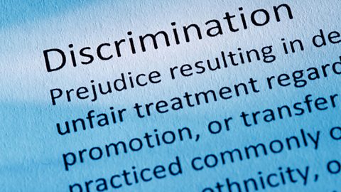 A definition of discrimination written in black text on a white background tinged with blue.