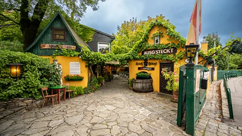Getty Images Just outside Vienna's city centre, the wine taverns and cobbled streets of Grinzing offer a taste of village life within a capital city (Credit: Getty Images)