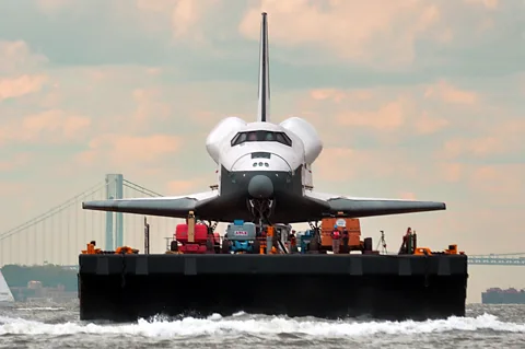 Getty Images Enterprise's final journey in 2012 saw it travel by air, road and barge to reach its final home at the Intrepid Sea, Air and Science Museum in New York City (Credit: Getty Images)