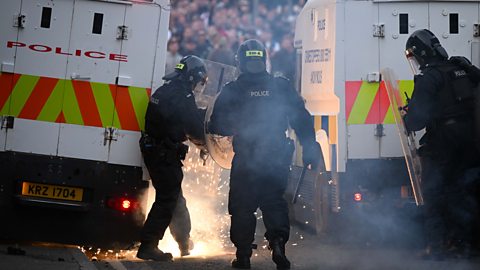 Three PSNI officers are behind two 