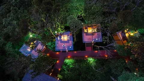 San Lucas Guests dine in glass cabins connected by a winding, lantern-lit walkway (Credit: San Lucas)