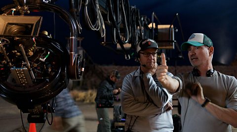Director Roland Emmerich directs the camera during production of Independence Day: Resurgence