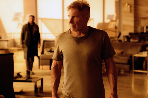 Actor Harrison Ford looks shocked and nervous in an interior setting for Blade Runner 2049