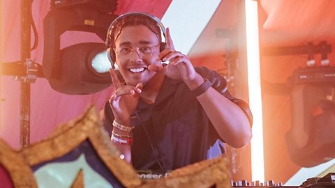 Aidan Hammond wearing headphones doing a DJ performance for Europe Music Festivals 2025-2026