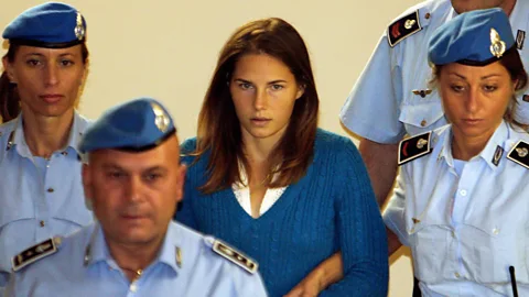 Getty Images The real Amanda Knox with Italian police in 2008; she has co-executive produced the new series (Credit: Getty Images)