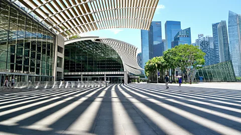 Alamy Many of Singapore's plazas and buildings have been designed to cast shadows to help keep pedestrians cooler (Credit: Alamy)