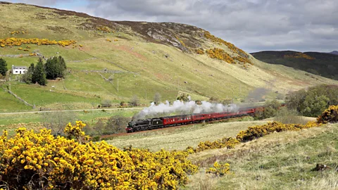 Alamy Scotland’s Far North Line rolls through the highlands past one of the country’s Unesco heritage sites (Credit: Alamy)