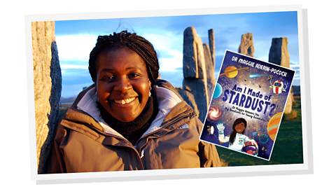 A woman smiling wearing a winter coat, standing in front of Stonehenge. A small image of a book titled Am I made of stardust? is next to her