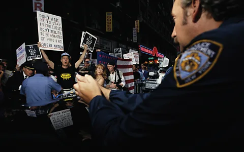 Getty Images Gay rights activists in the 1990s protesting against the US military's "don't ask, don't tell" policy (Credit: Getty Images)
