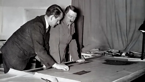 Alamy Adolf Hitler and Albert Speer leaning over a table (Credit: Alamy)