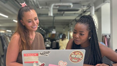 Sian, a fashion designer at ASOS and Emma-Louise Amanshia looking at a laptop screen together