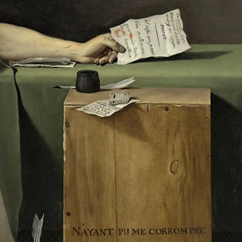Musée du Louvre / Mathieu Rabeau At the centre of the canvas are two letters – between the two documents, the plot of the painting is written (Credit: Musée du Louvre/ Mathieu Rabeau)