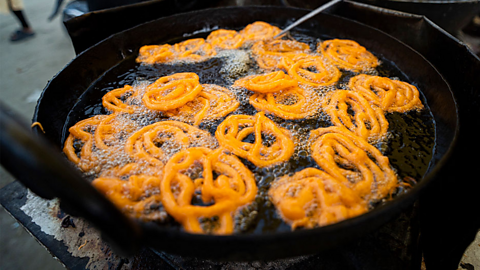 A photo of jalebi being fried in India.