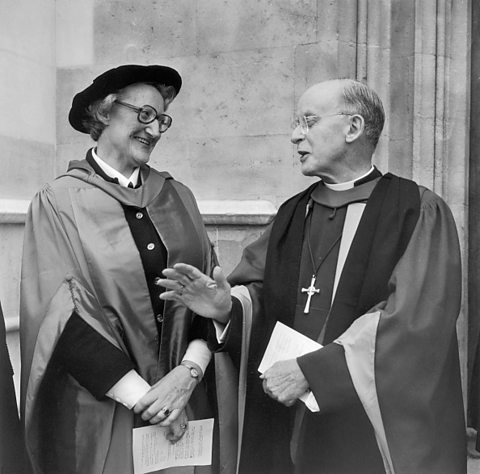 Dame Cicely Saunders receiving her Doctorate of Medicine from Dr Coggan, Archbishop of Canterbury.