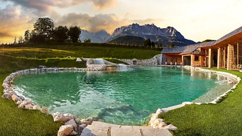 Stanglwirt The property's natural swimming pond is purified through a plant-based filtration system and fed by its own spring (Credit: Stanglwirt)