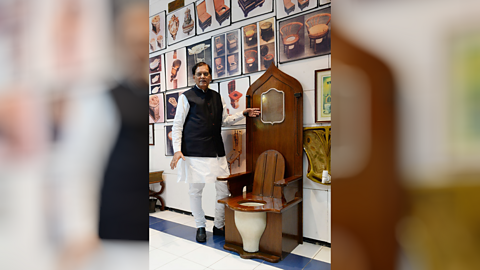 Replica of King Louis XIV wooden throne toilet displayed at Sulabh International Museum of Toilets in New Delhi, India.