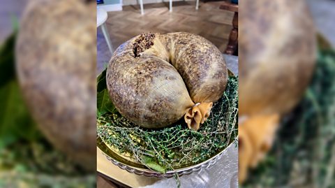 Traditional Scottish Haggis - minced sheep’s organs, oatmeal, onions and spices stuffed into a sheep’s stomach - served on a plate