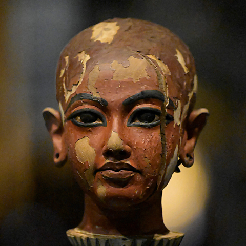 A photo of a wooden statue of the pharaoh Tutankhamun.
