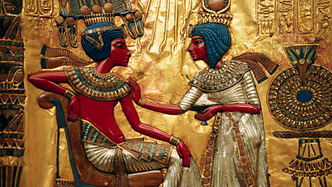 A photo of a scene from Tutanhamun's life from his throne.
