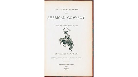 We see the front cover of Clark's book about being a cowboy in the far west, Better Known as the Rattle-Snake King. Image of Clark dressed as a cowboy on a horse with lassoo