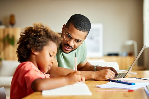 Parent and child doing homework.