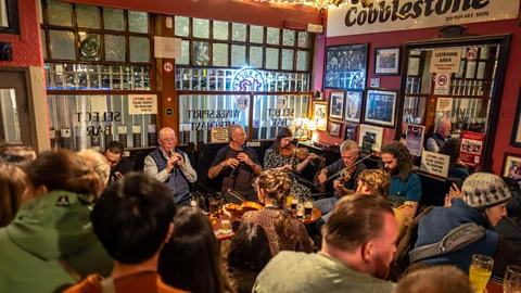 Alamy Irish music is a quintessential part of the Irish pub experience (Credit: Alamy)