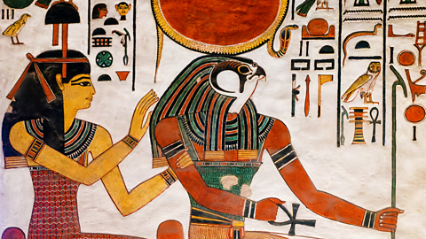 A relief the sun god Ra on the wall of a tomb.