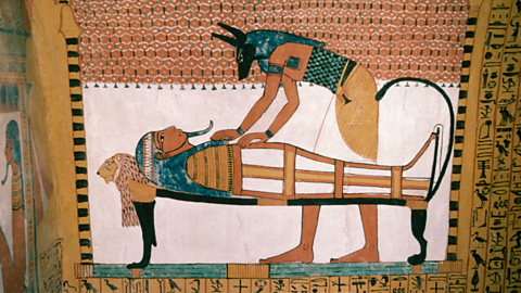 A photo of a relief of the god Anubis.