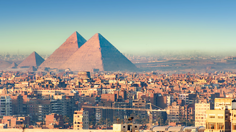 A photo of Cairo, Egypt with the pyramids of Giza in the background.
