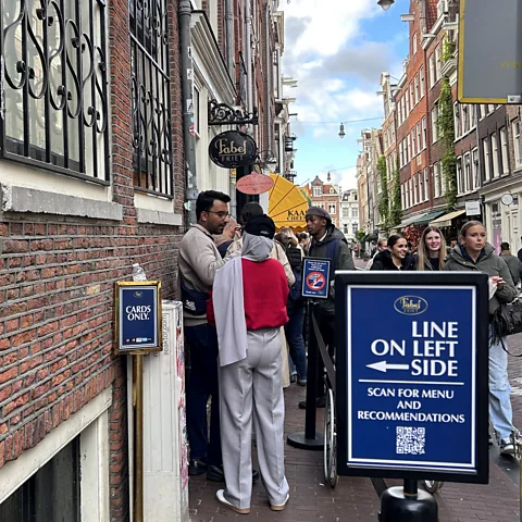 Apeksha Bhateja Fabelfriet's fries are so popular that the Amsterdam shop has installed signage to manage the ever-present queue (Credit: Apeksha Bhateja)