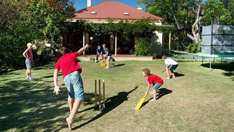 Getty Images Australia's sun-soaked Christmas Day often involves a game of backyard or beach cricket (Credit: Getty Images)