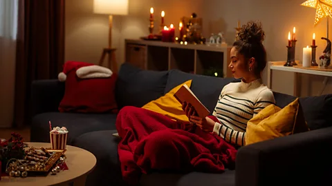 Getty Images The Icelandic tradition of Jólabókaflóð involves exchanging books as Christmas gifts and spending Christmas Eve reading them (Credit: Getty Images)