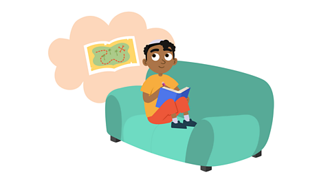 A boy reading a newspaper