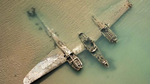 A WW2 plane in the sea.