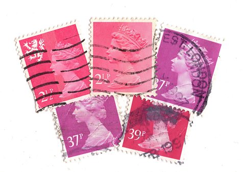 A montage of pink vintage postage stamps from the United Kingdom featuring a portrait of Queen Elizabeth II on a white background