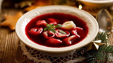 Poland's Barszcz wigilijny or Christmas Eve Barszcz is a beetroot broth with uszka (little ears) dumplings
