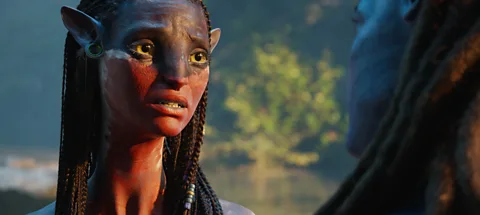 Disney A still of a Na'vi alien with a sad expression in Avatar: Fire and Ash (Credit: Disney)
