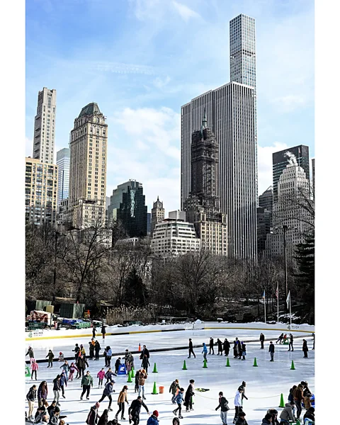 Getty Images Ice skating in Central Park is a classic holiday activity for visitors and locals alike (Credit: Getty Images)