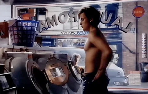 'Launderette' Levi's advertisement, Bartle Bogle Hegarty Still of topless Nick Kamen in the Levi's ad in a retro launderette (Credit: 'Launderette' Levi's advertisement, Bartle Bogle Hegarty))
