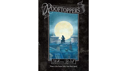 Book cover of Rooftoppers by Katherine Rundell featuring a silhouette of a person standing on rooftops under a large glowing moon with a starry night sky.