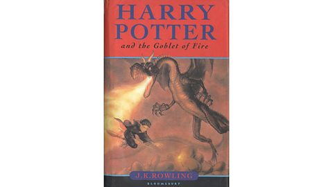 Book cover of Harry Potter and the Goblet of Fire by J.K. Rowling depicting a dragon breathing fire at a flying figure against a fiery backdrop.