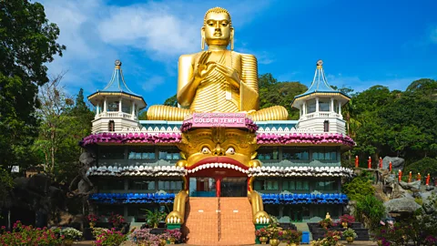 Getty Images The Golden Temple of Dambulla features five caves containing more than 150 Buddha statues (Credit: Getty Images)