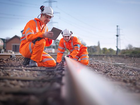 Men working train track