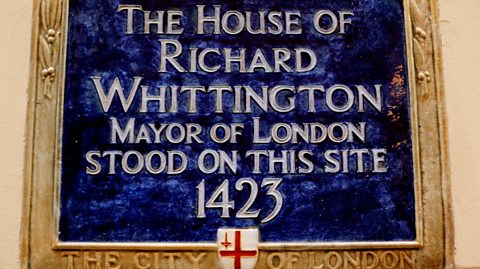 Historic blue plaque marking the site of Richard Whittington's house, Mayor of London, dated 1423, with City of London crest.