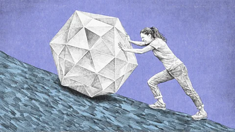 Emmanuel Lafont An illustration of a woman struggling to push a sphere made of triangles up a hill (Credit: Emmanuel Lafont)
