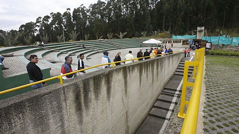 Tourists queue at ground level to enter down in to the Salt Cathedral, Colombia