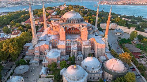The Hagia Sophia or Blue Mosque is seen at sunset, overlooking the Bosphorus River in Istanbul